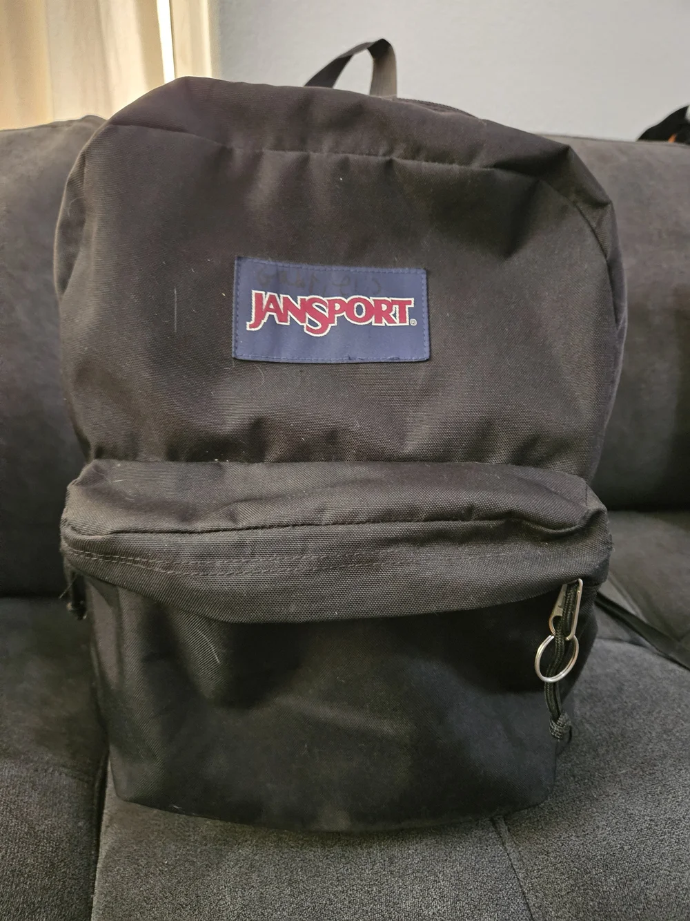 Jansport Black Classic Daypack with Red Logo Patch